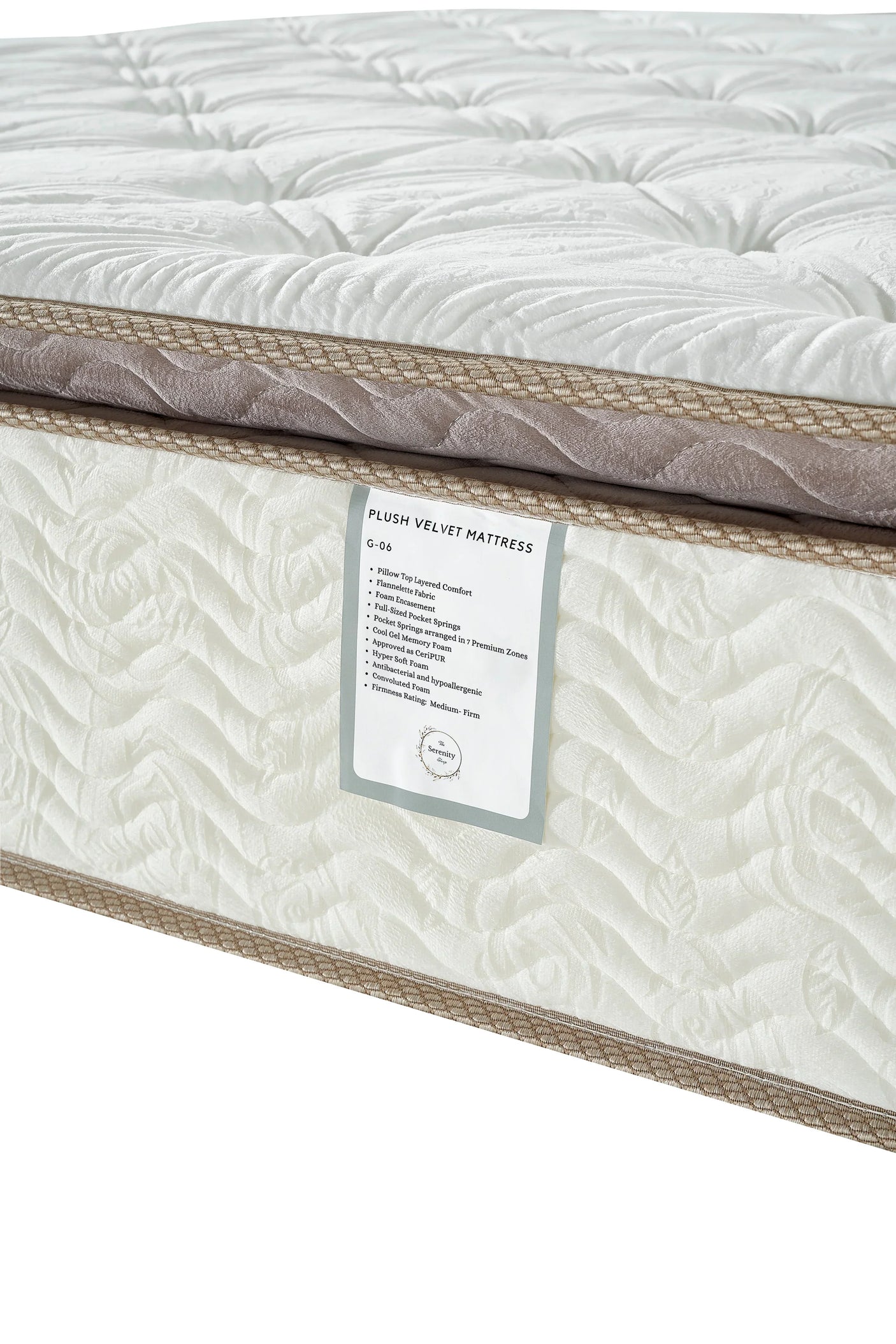 Plush velvet mattress with quilted white surface and taupe trim, closeup on label and texture