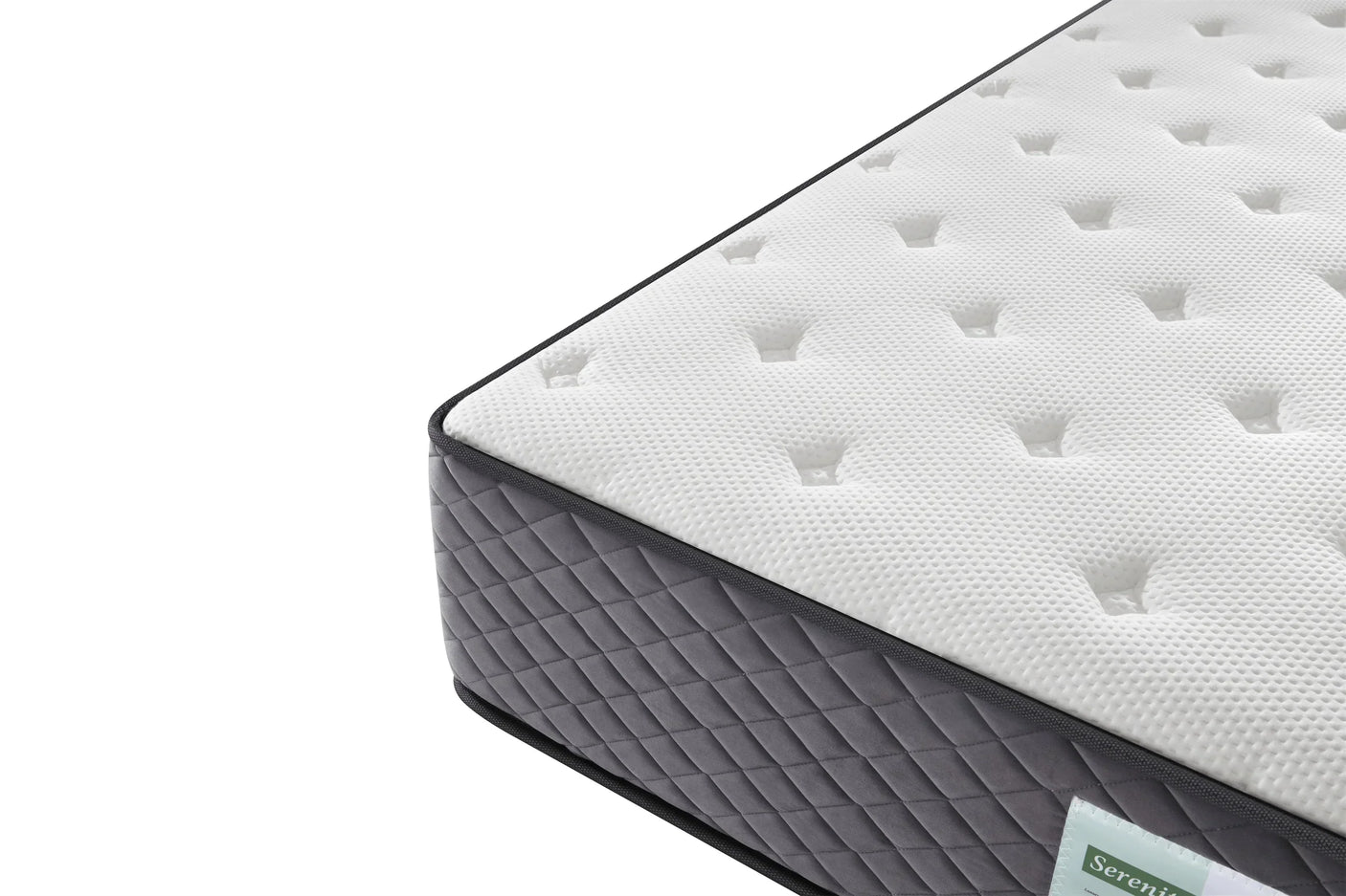 Corner detail of white mattress with quilted grey fabric sides and textured top surface