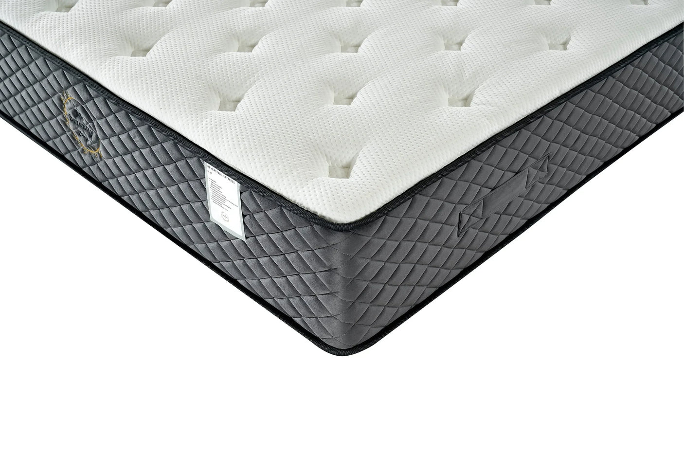 Quilted mattress with white top and grey sides, showing corner detail and stitched handles