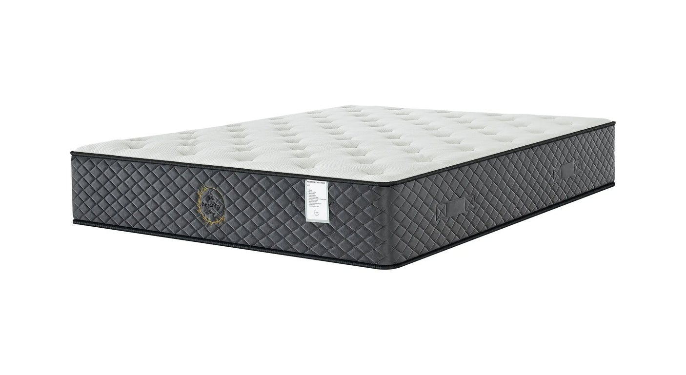 Quilted grey and white mattress with side handles and tufted top surface