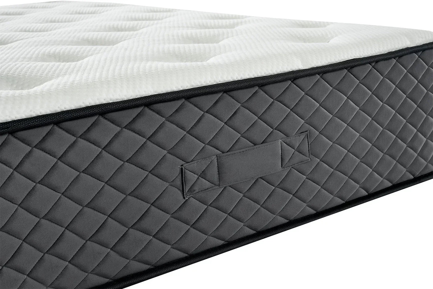 Memory foam mattress with quilted grey side panel and stitched fabric handle, close-up view