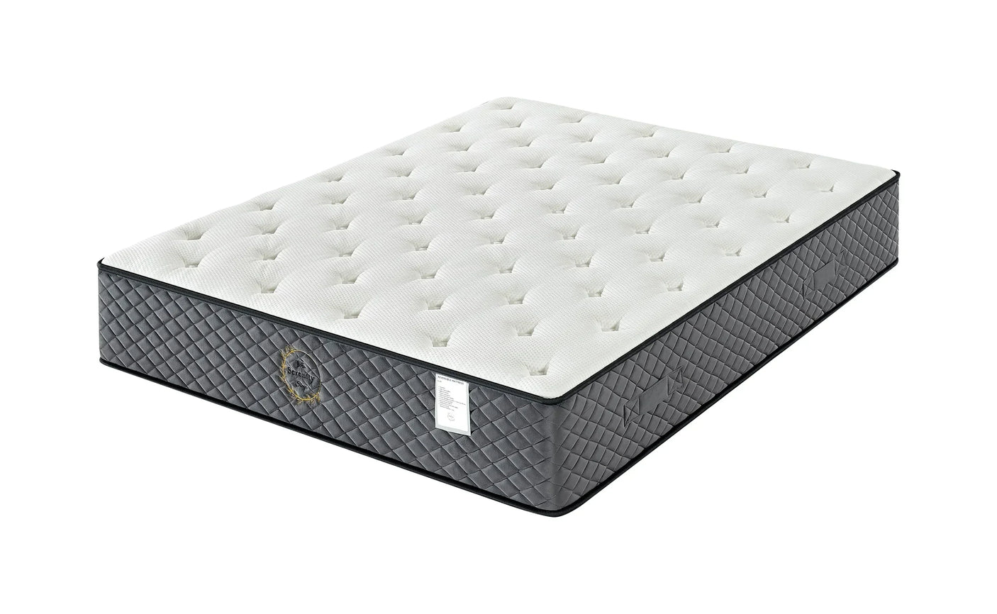 Double mattress with quilted grey sides and tufted white top, angled view