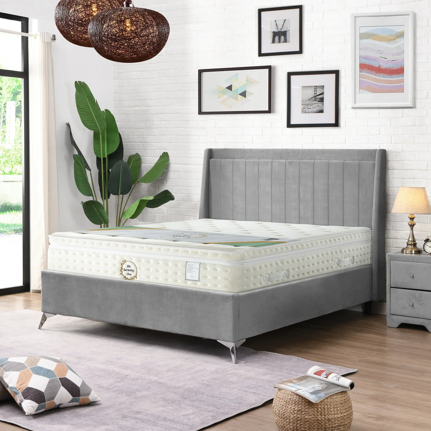 Grey upholstered bed frame with mattress in modern bedroom setting