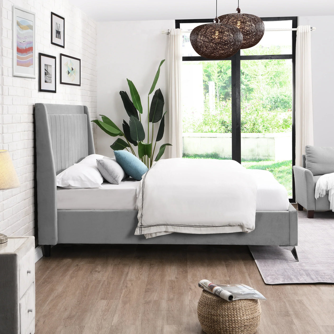 Grey upholstered bed with vertical panel headboard in modern bedroom with large window