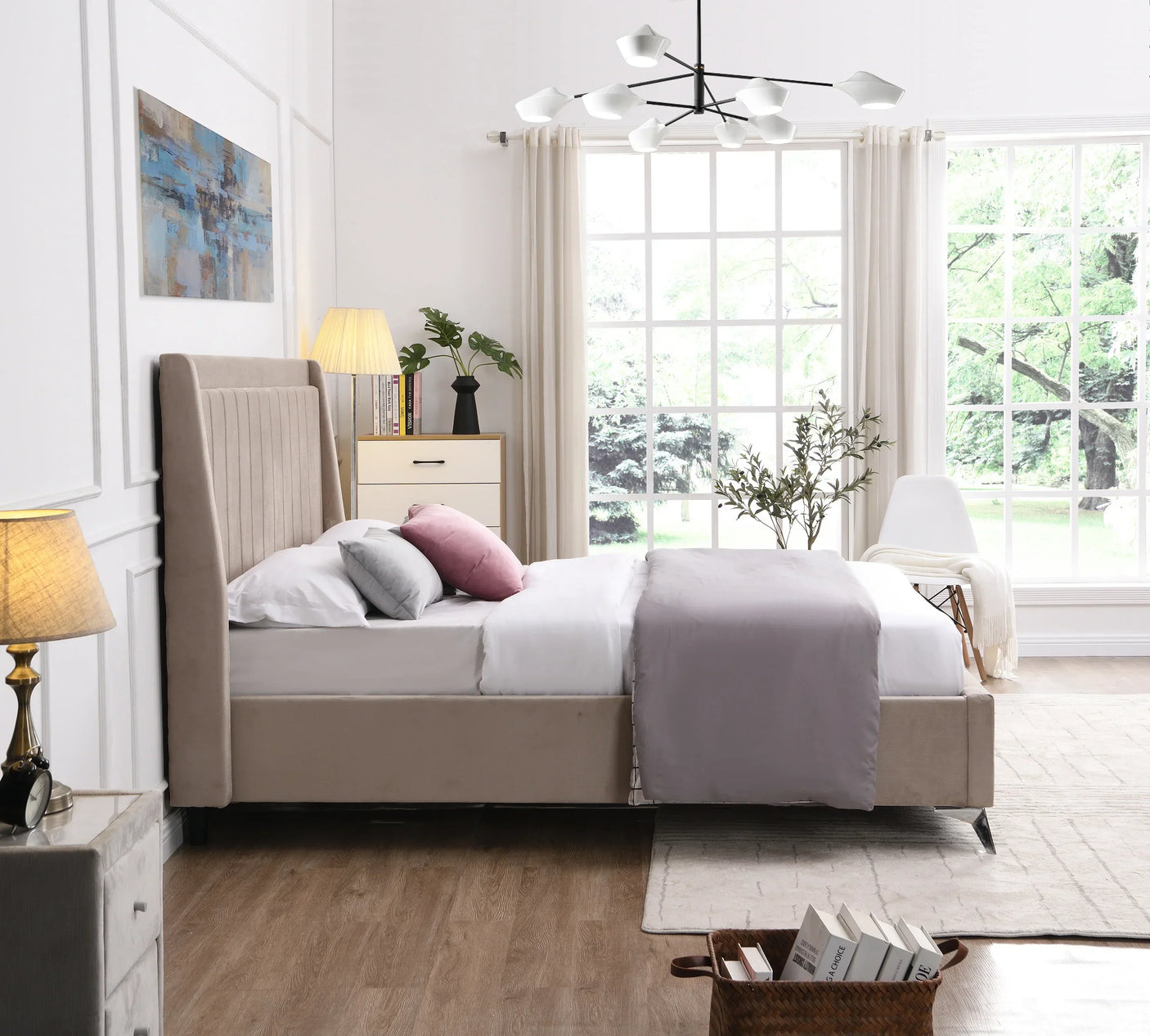 Beige upholstered bed with headboard in bright modern bedroom with large window and soft bedding