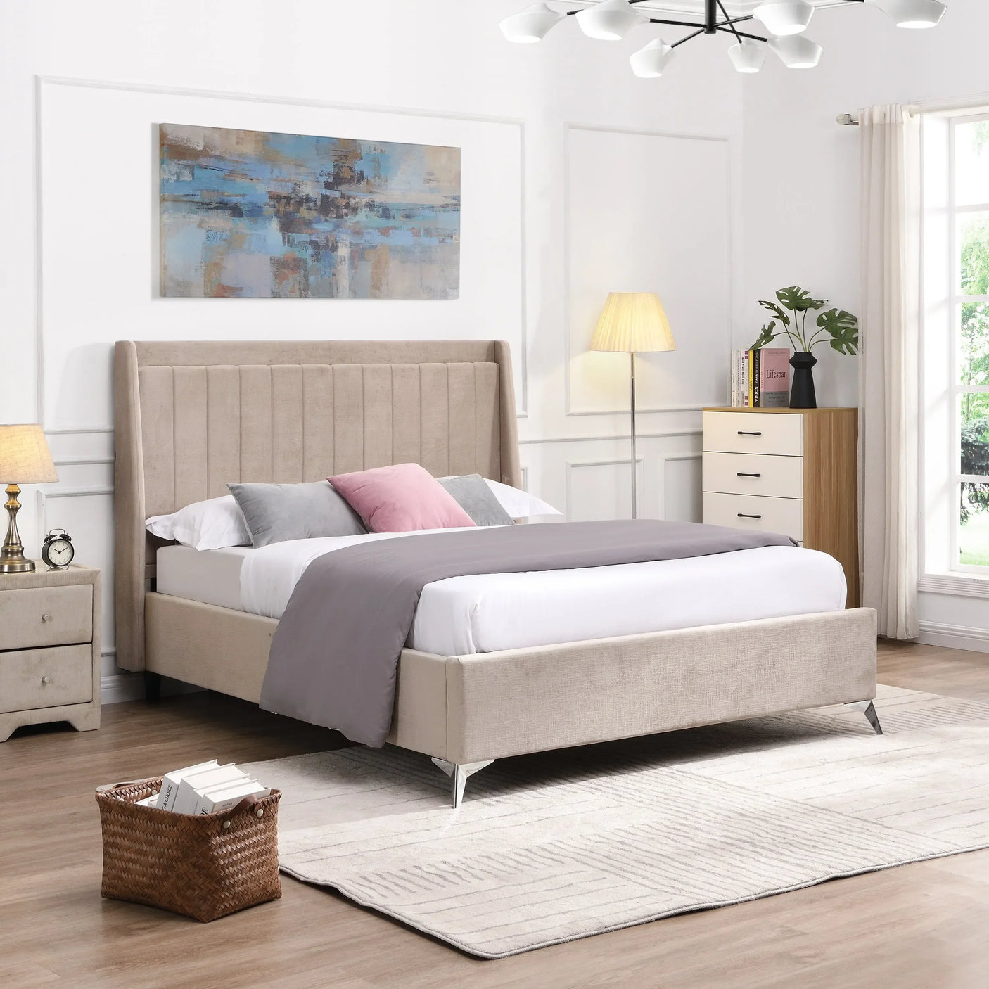 Beige upholstered bed with panel headboard, grey bedding, and modern bedroom decor