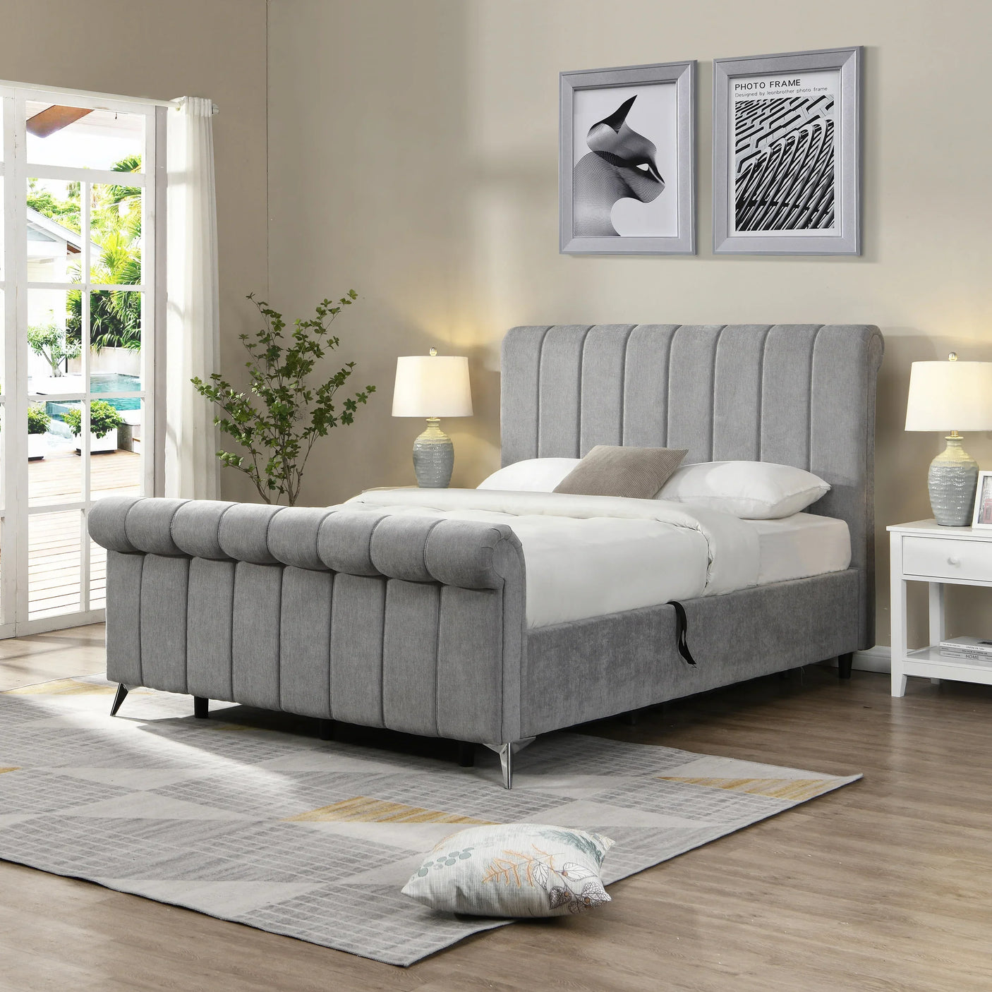 Grey upholstered bed with vertical panel headboard in modern bedroom setting with lamps