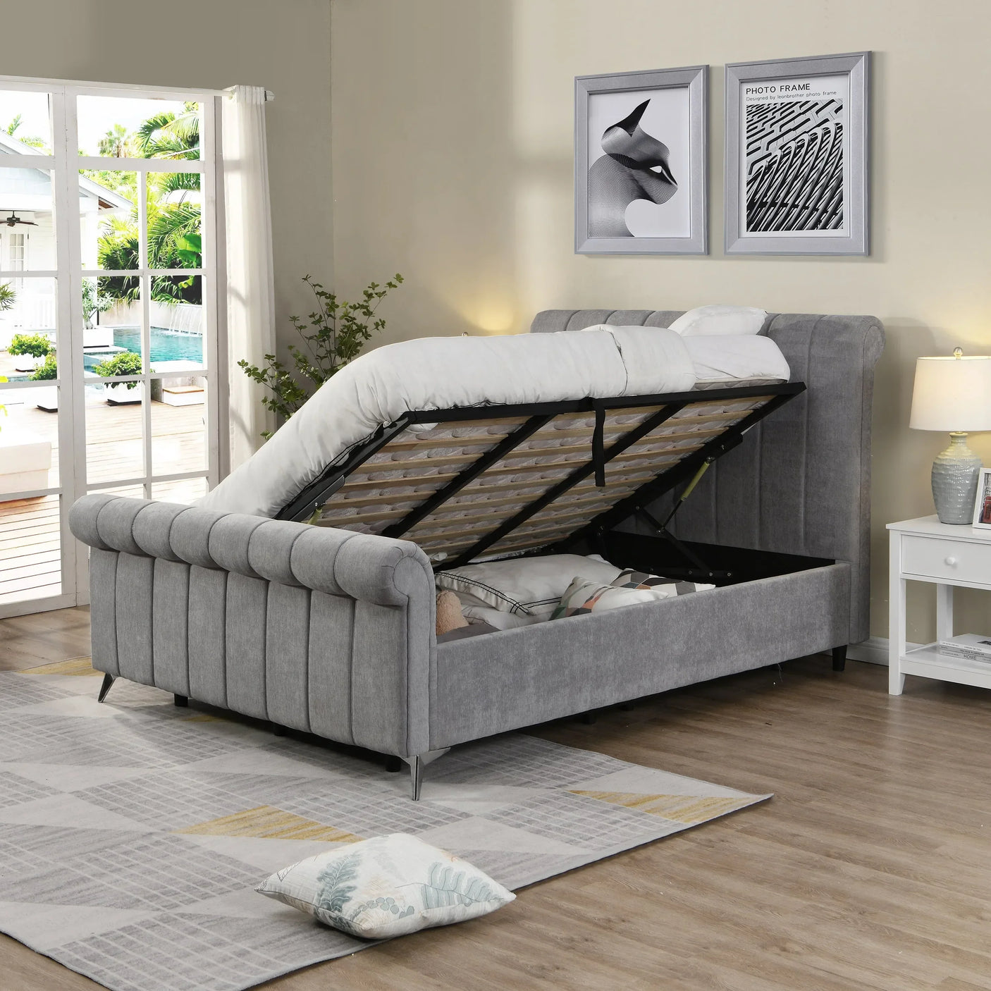 Grey upholstered ottoman bed with lifted storage compartment in modern bedroom