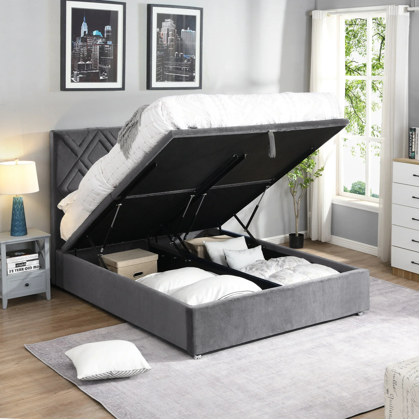 Grey upholstered ottoman storage bed with mattress lifted to show underbed storage compartments