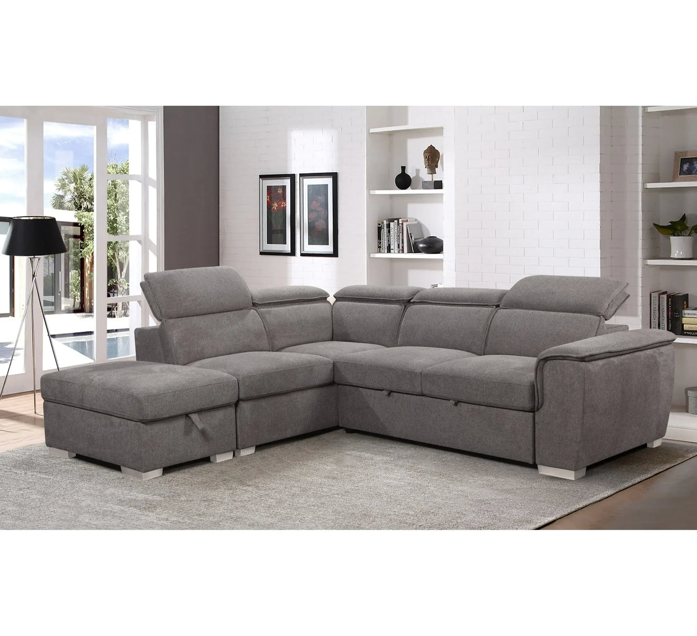 Grey corner sofa with adjustable headrests in modern living room on light carpet