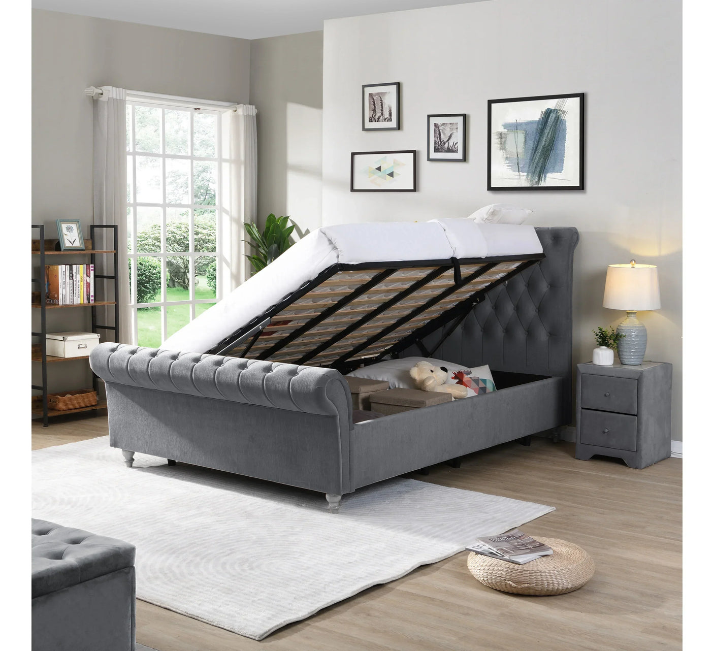 Grey upholstered ottoman storage bed with lifted mattress in modern bedroom
