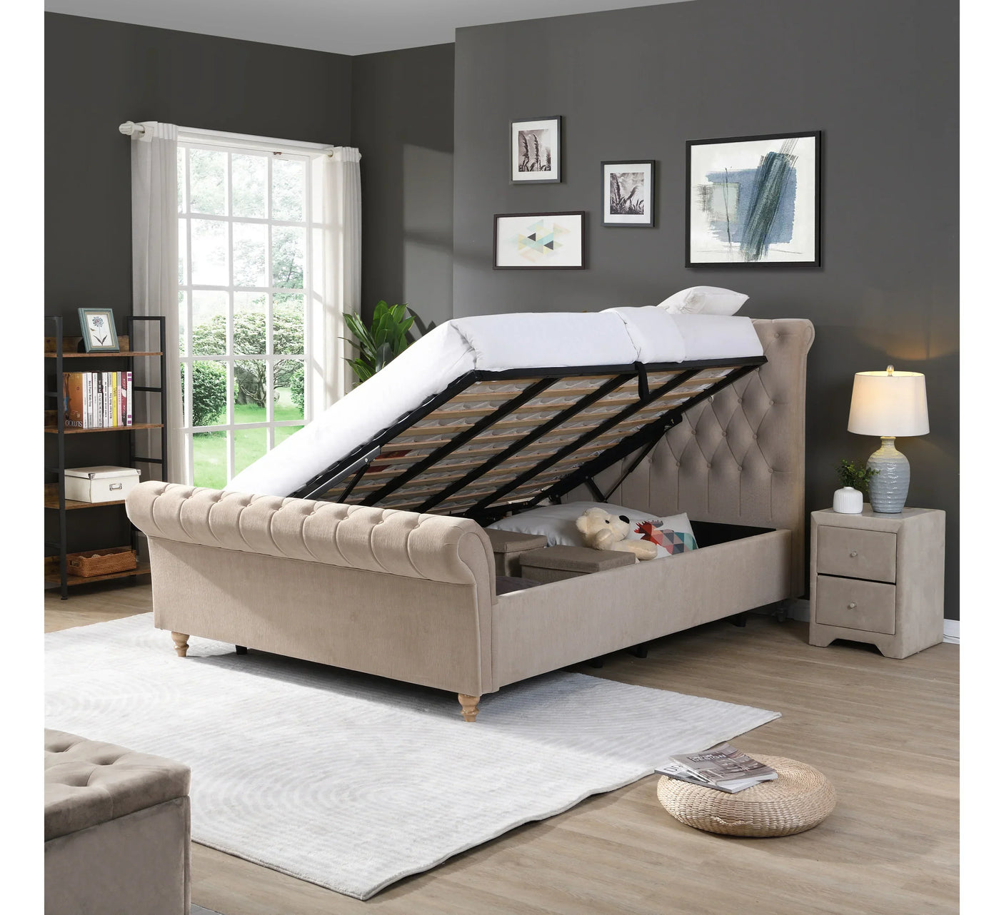 Beige upholstered ottoman storage bed with mattress lifted in modern bedroom