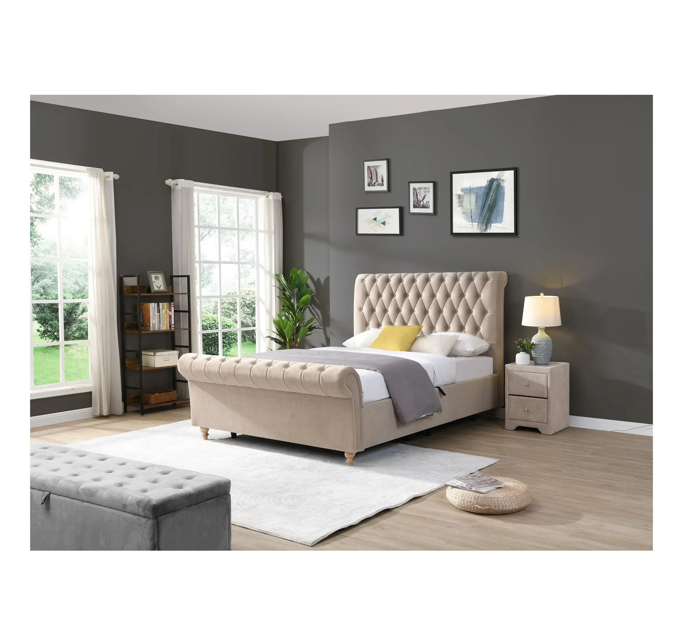 Beige upholstered bed with button tufting in modern bedroom with grey walls and large windows