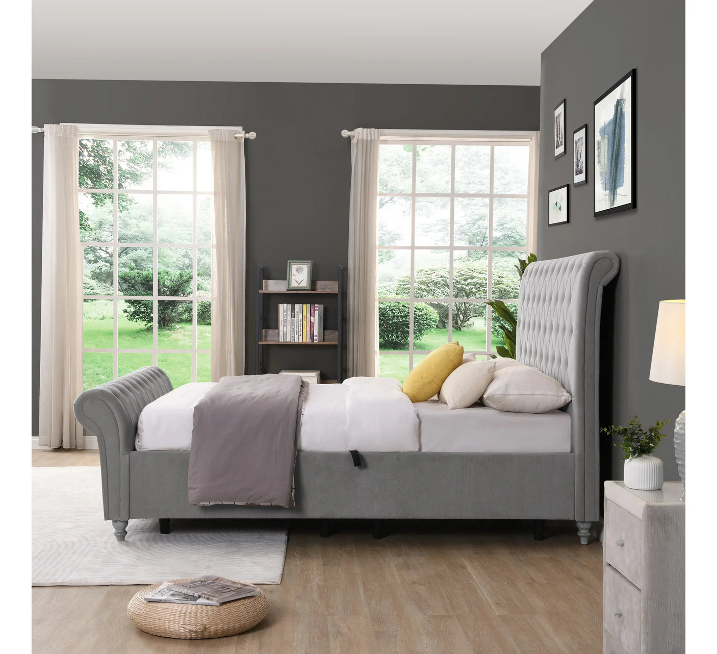 Grey upholstered bed with button-tufted headboard and footboard in modern bedroom