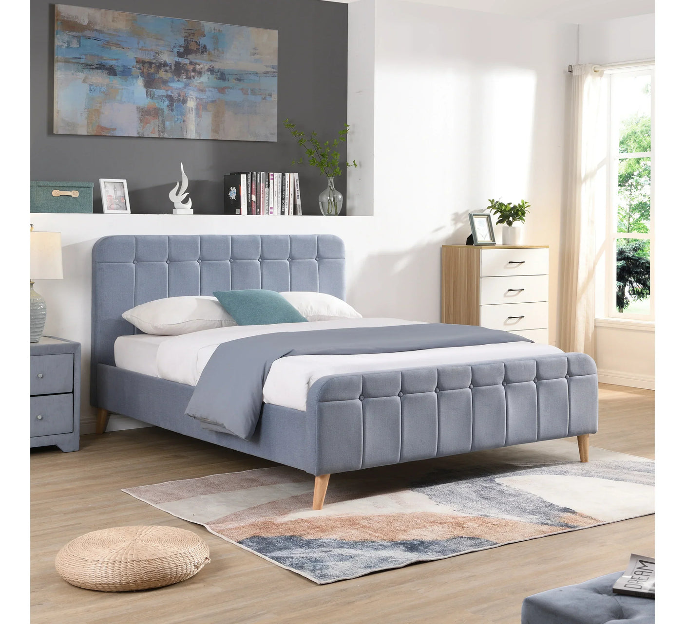 Grey upholstered bed frame with panel tufting in modern bedroom setting