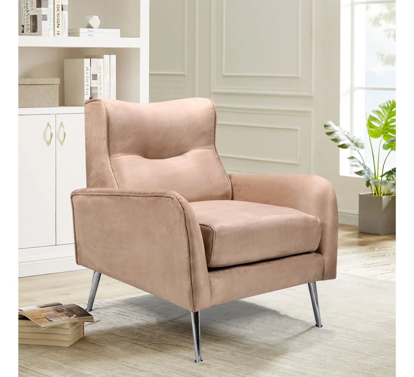 Beige velvet armchair with metal legs in modern living room setting