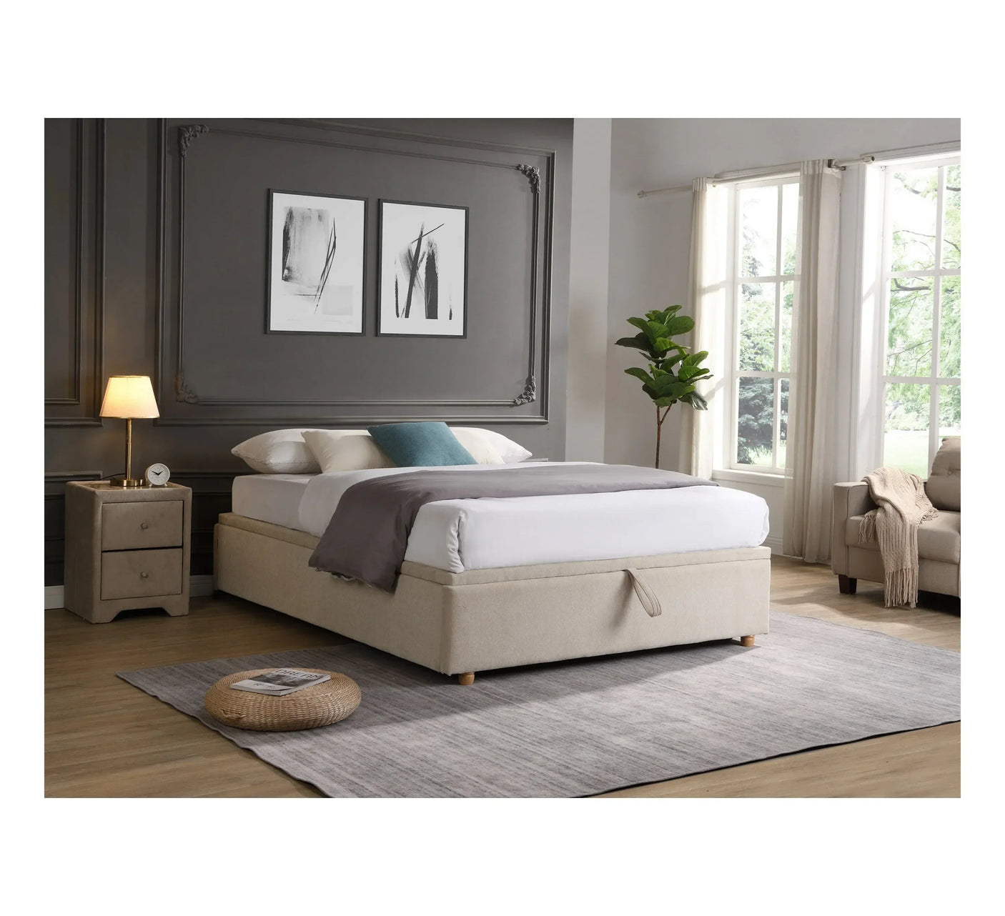 Beige upholstered ottoman bed with storage in modern bedroom, bedside table and large window