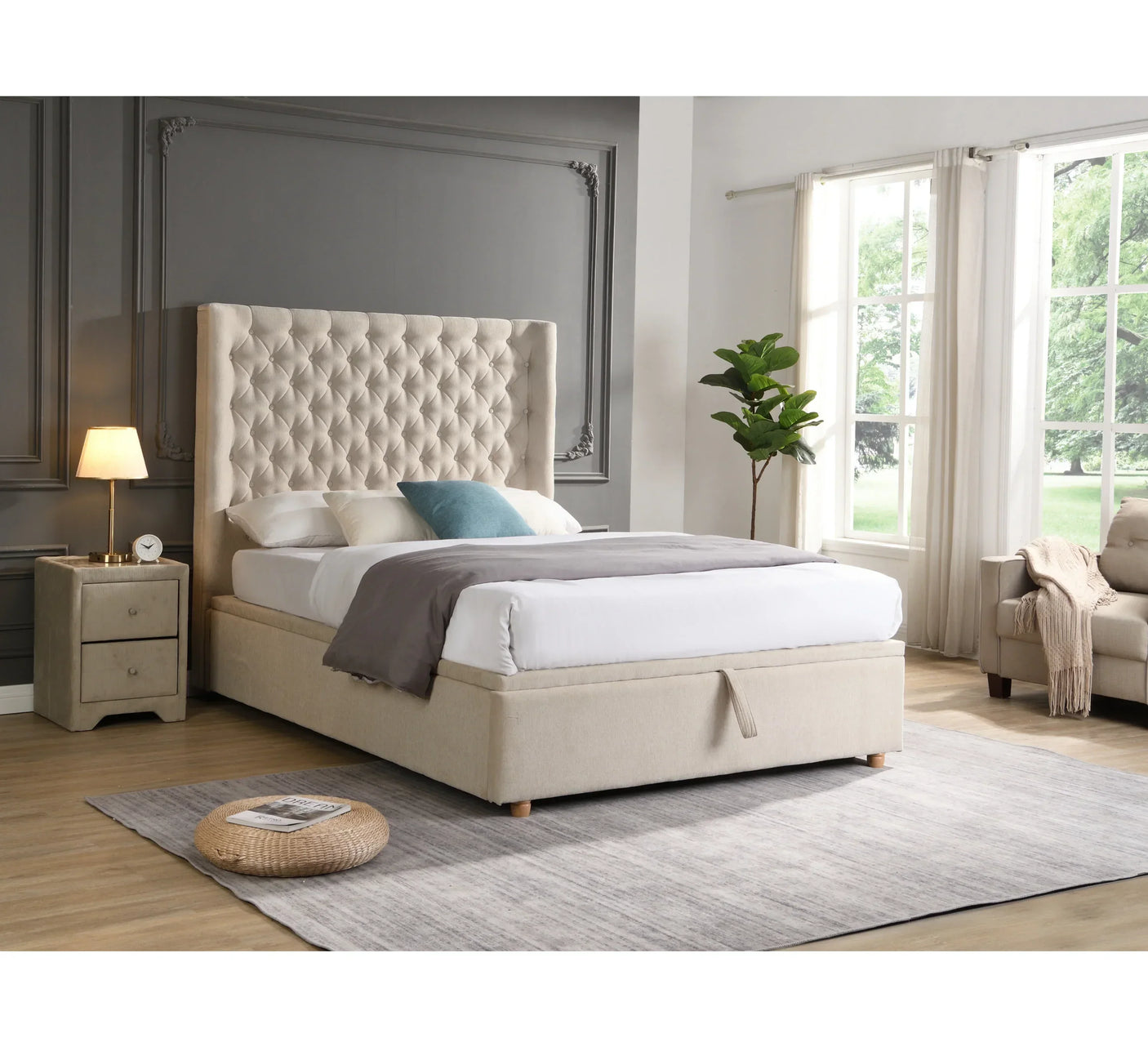 Beige upholstered bed with tufted headboard in modern bedroom with large window and nightstand