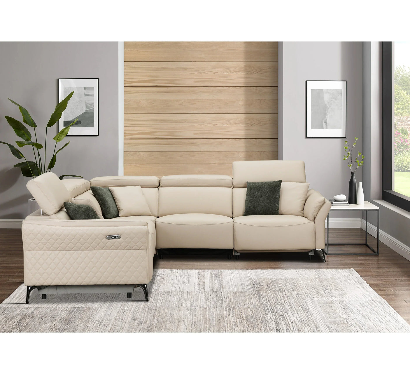 Beige leather corner sofa with recliner and green cushions in modern living room