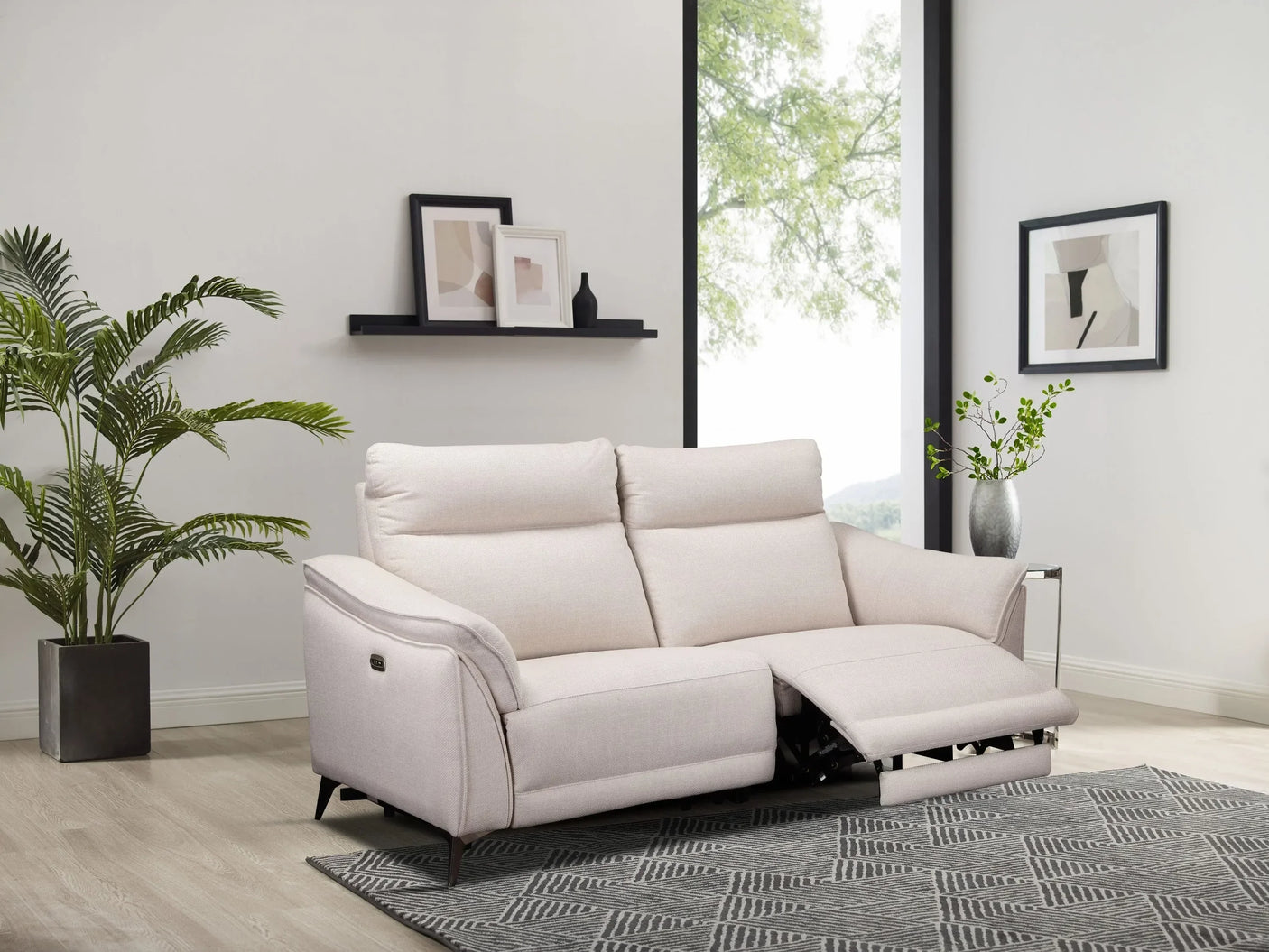 Light beige fabric recliner sofa with footrest extended in modern living room setting
