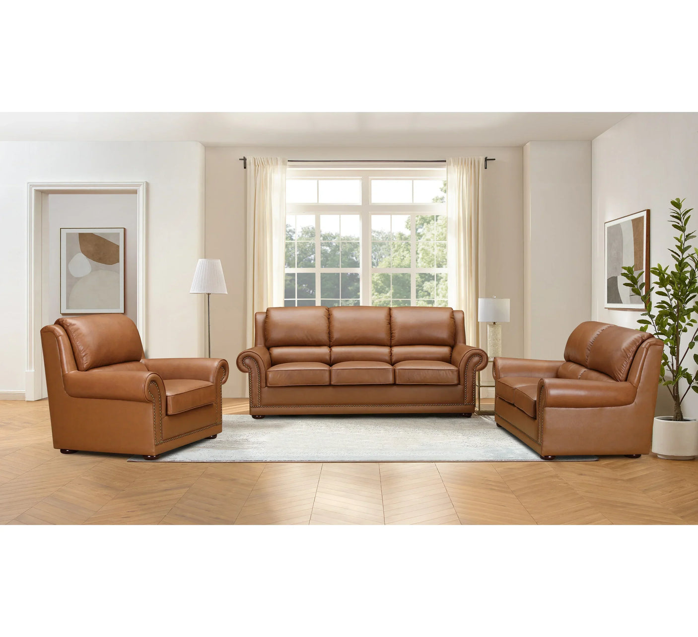 Brown leather sofa set with armchair and loveseat in bright modern living room