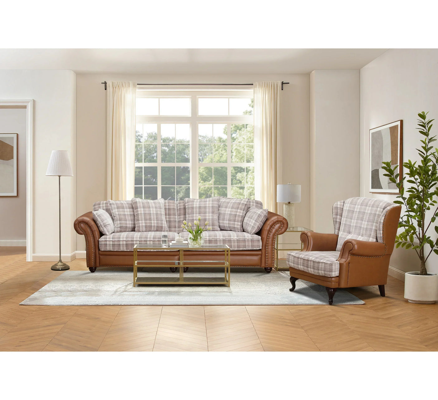 Brown leather sofa and armchair set with plaid cushions in a bright living room
