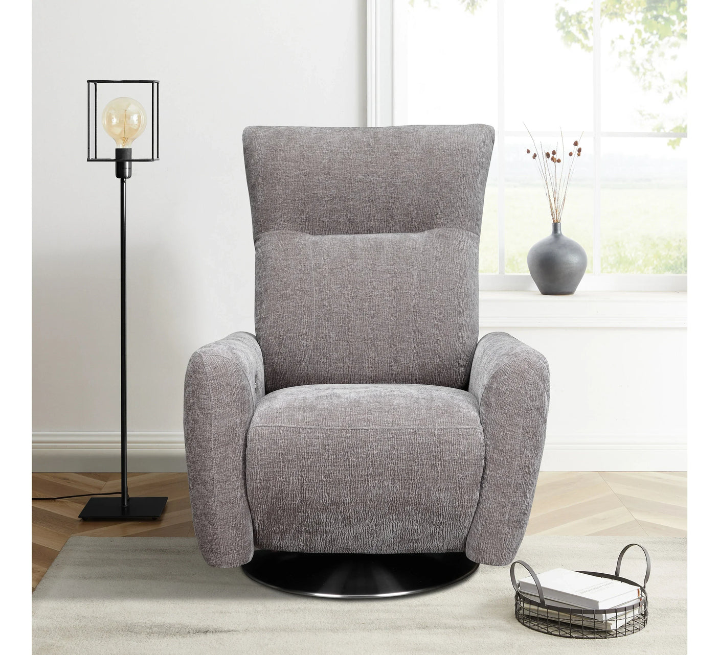 Grey fabric swivel armchair with high backrest in modern living room corner