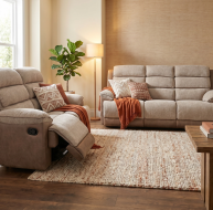 Cozy living room featuring the Jessica Two-Tone Fabric Collection with reclining sofa and loveseat