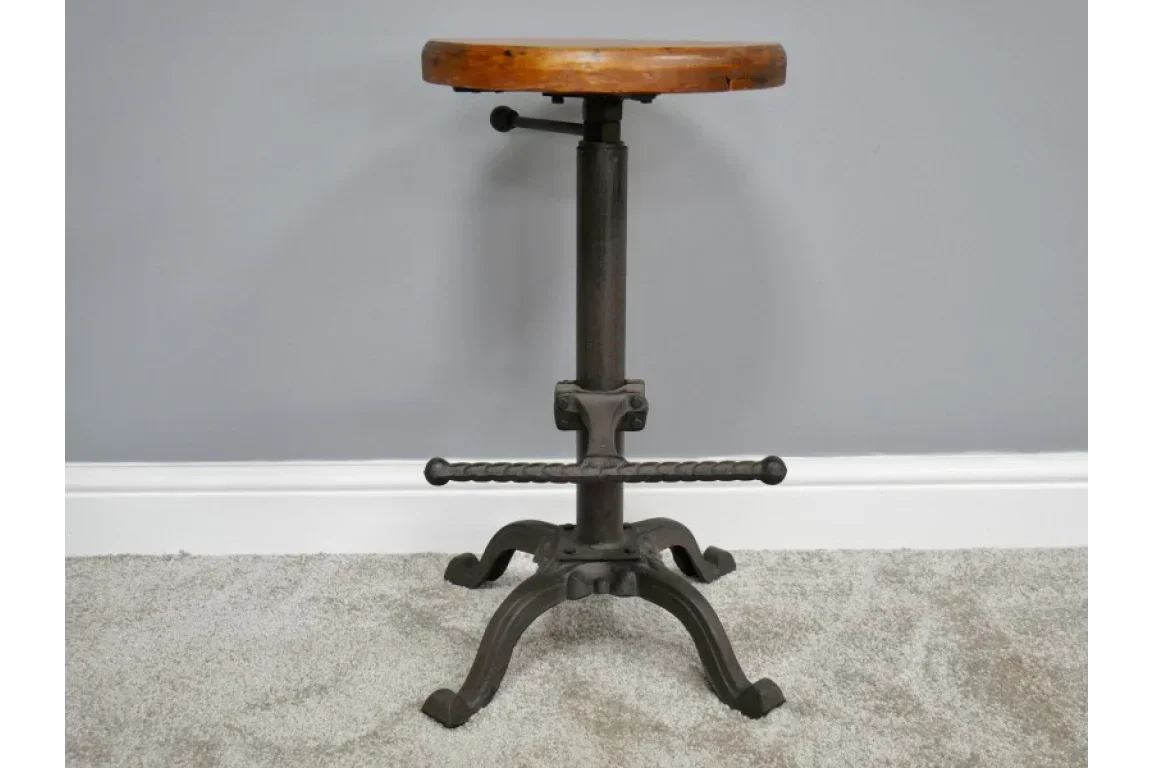 Industrial bar stool with round wooden seat and black metal adjustable base