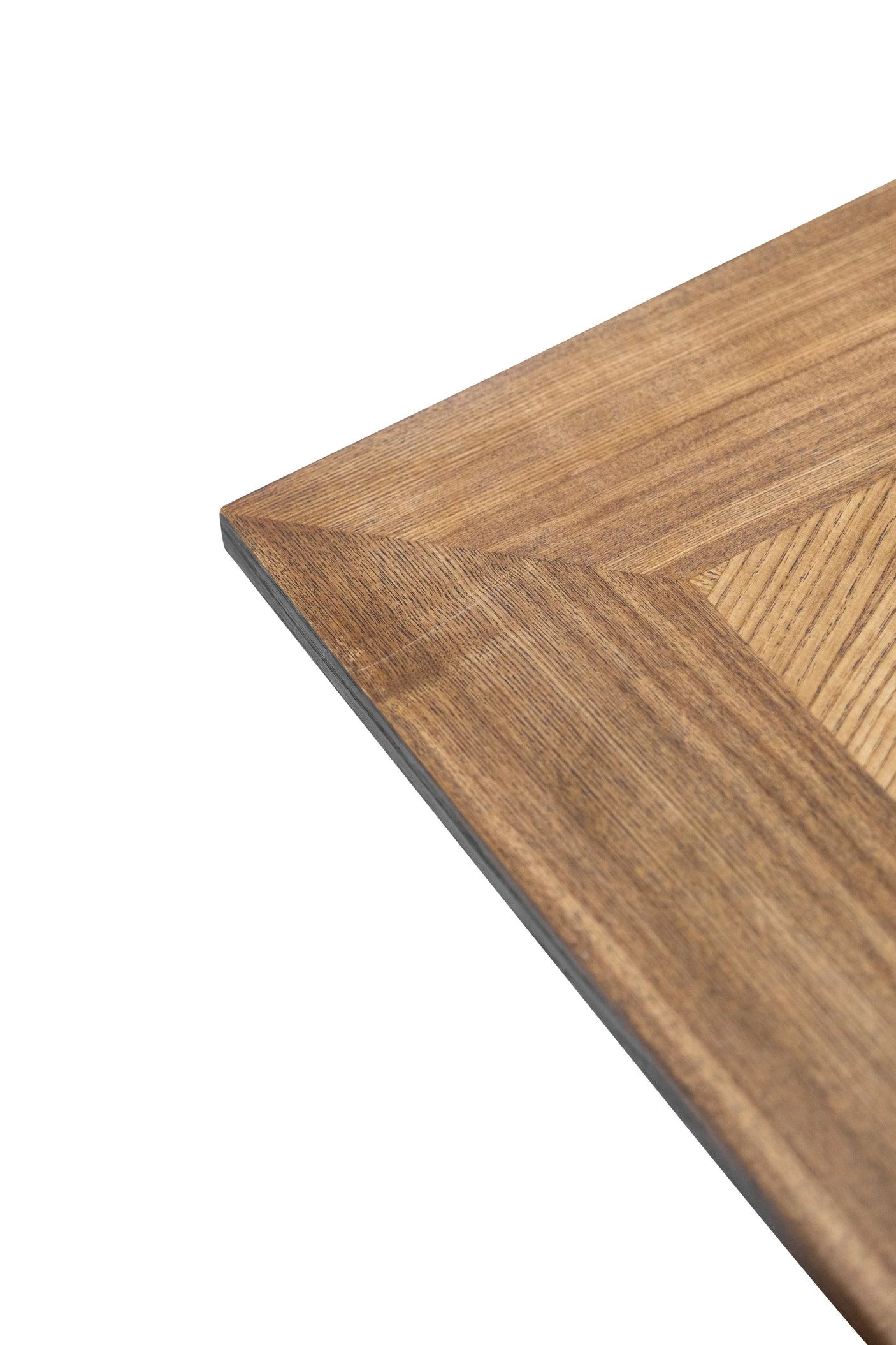 Corner detail of wood dining table top with natural grain finish