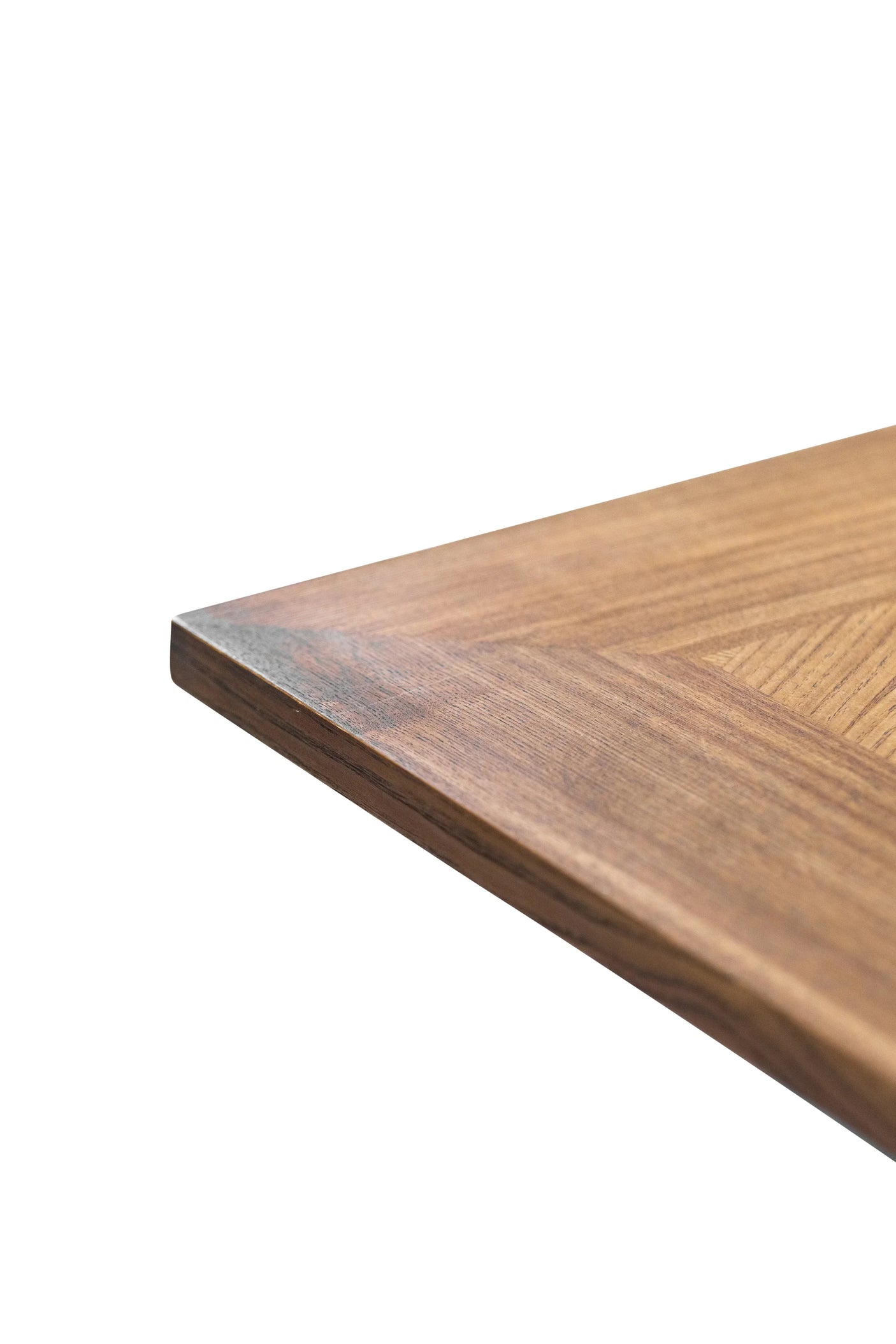 Close-up of wooden dining table corner with natural grain and smooth finish
