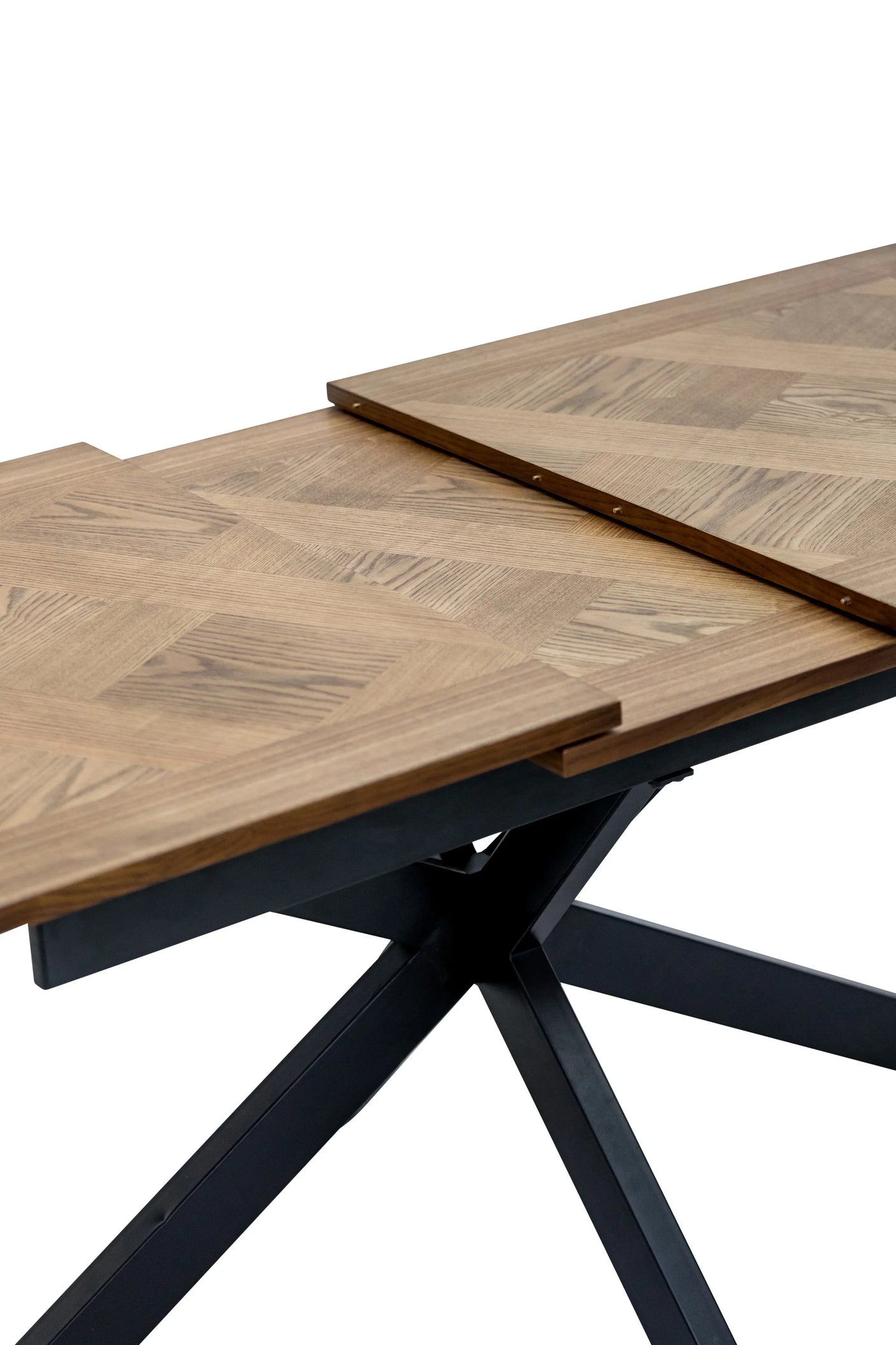 Wooden extending dining table with parquet top and black metal legs, partially extended