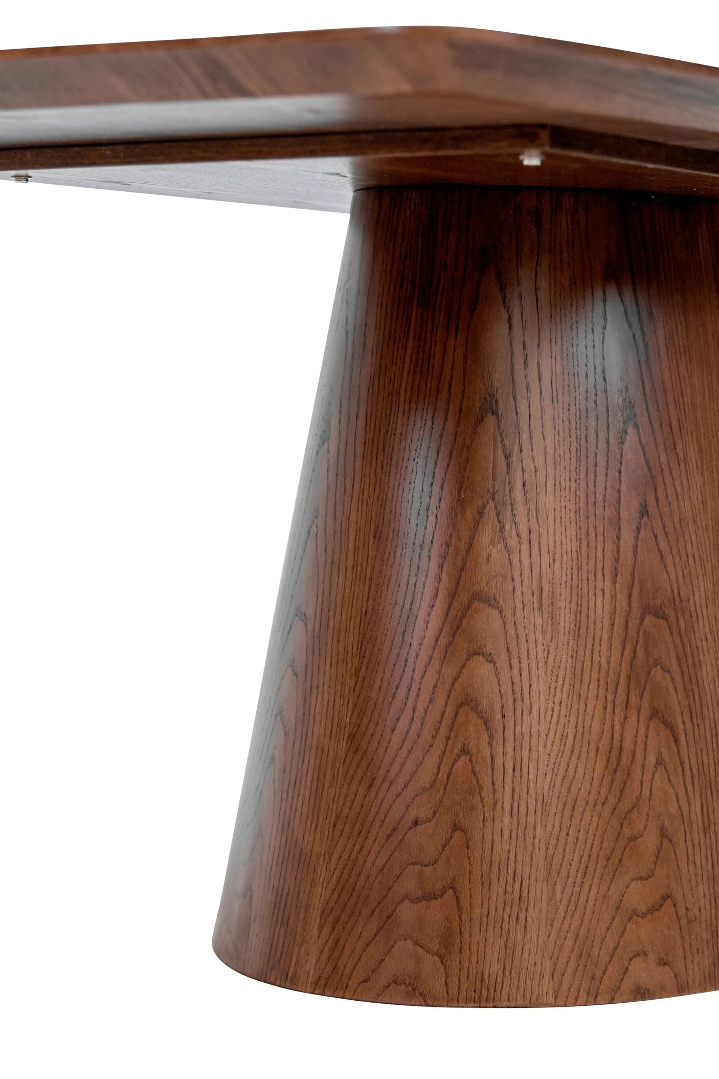 Closeup of wooden dining table base with rich brown finish and natural grain detail
