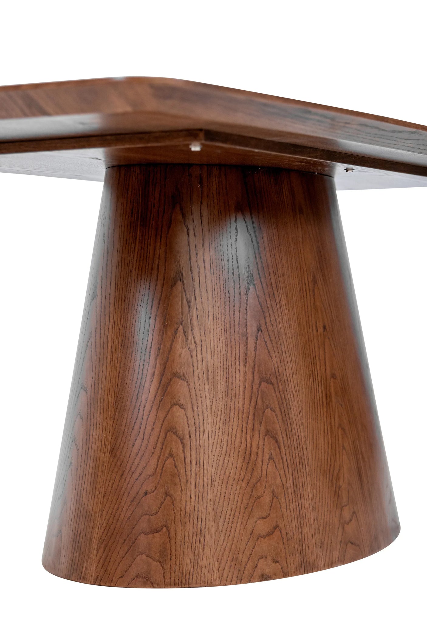 Close-up of wooden dining table base with conical design and visible grain pattern