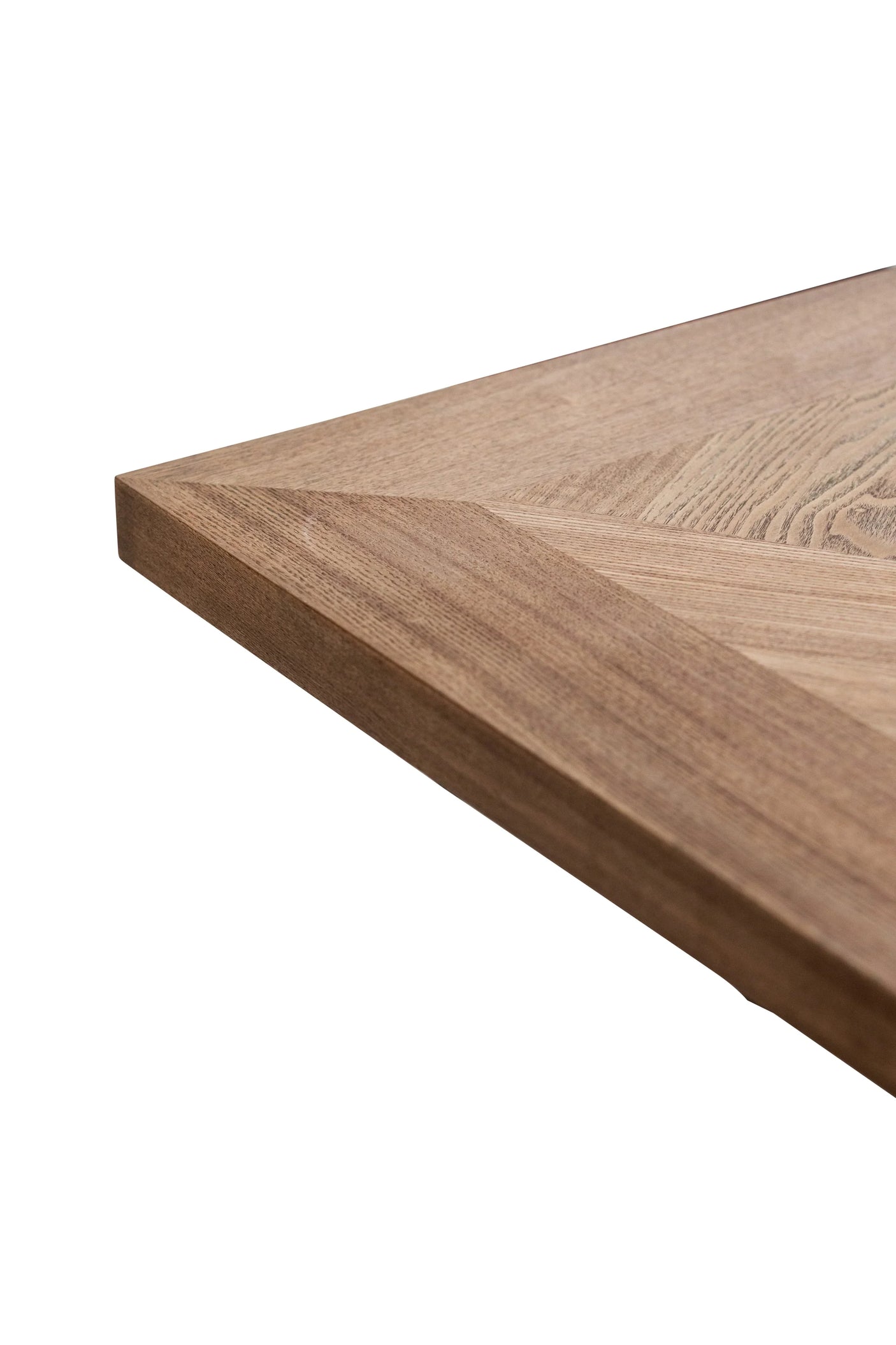 Close up of oak wood dining table corner with natural grain and bevelled edge