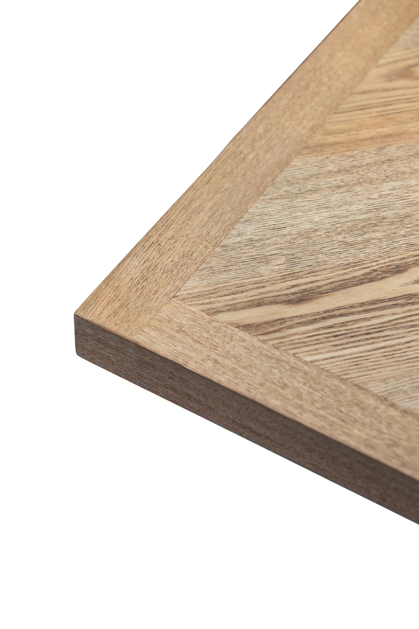 Close up of oak wood table top corner showing natural grain and smooth edge