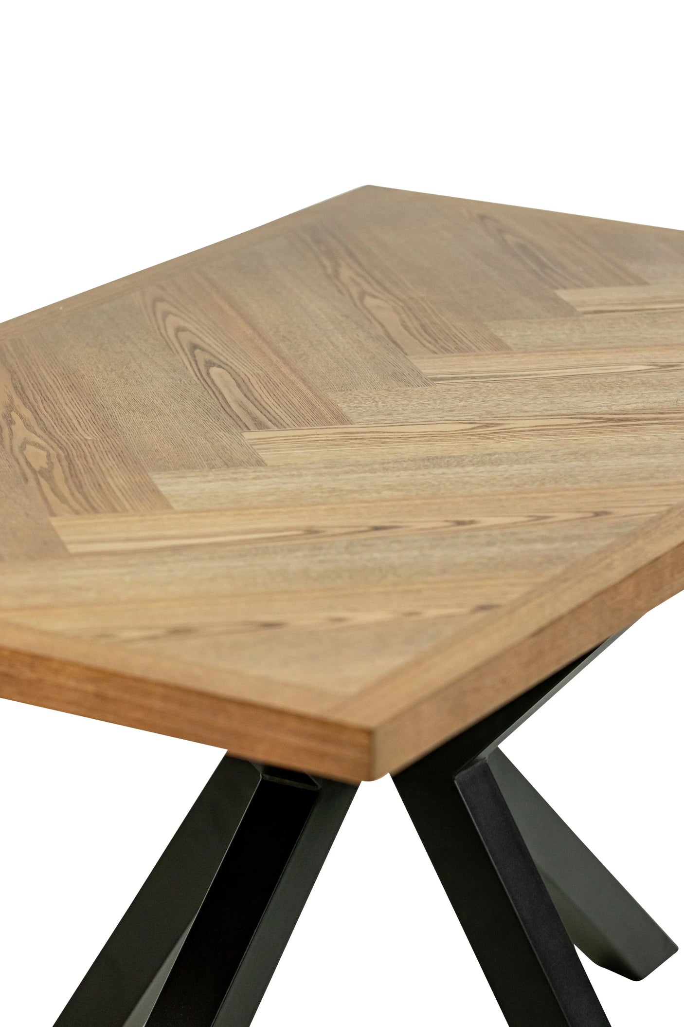 Rectangular dining table with light wood herringbone top and black metal legs