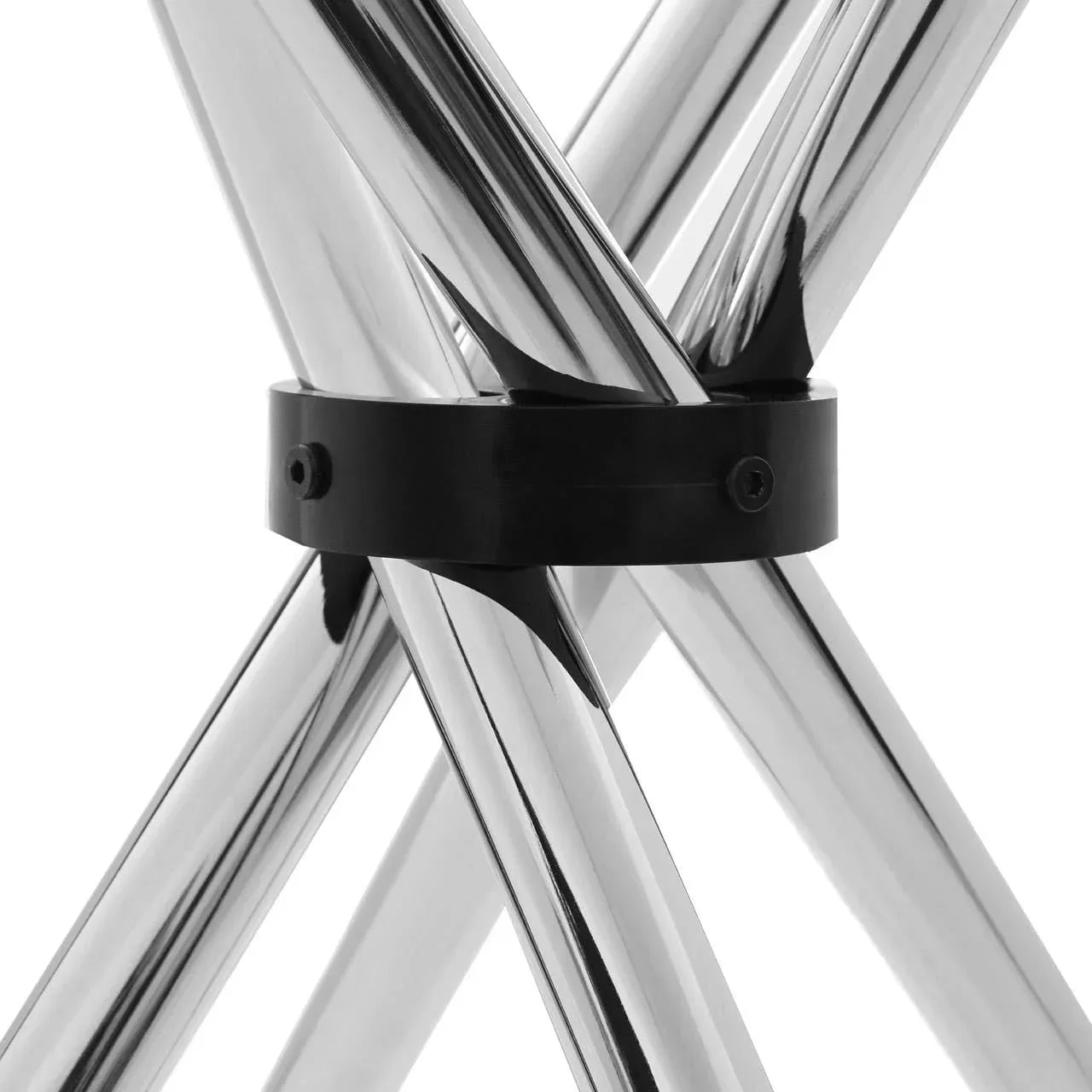 Chrome table legs with black connector and screw detail, close-up view