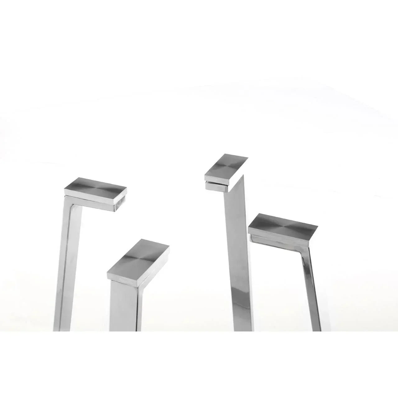 Close-up of four chrome metal table legs with angled design on white background