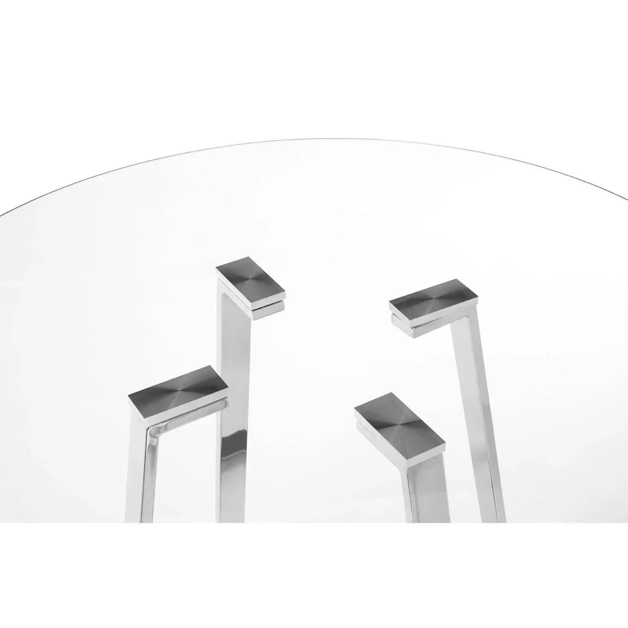 Modern glass dining table with chrome metal legs and round clear top