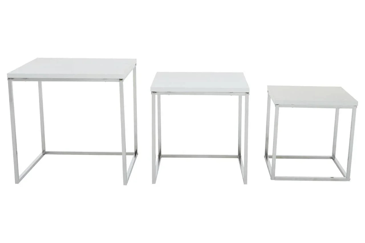 Set of three white nesting tables with metal frames arranged side by side on white background