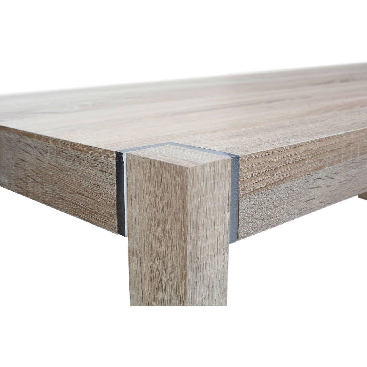 Light oak dining table corner showing wood grain and square leg detail