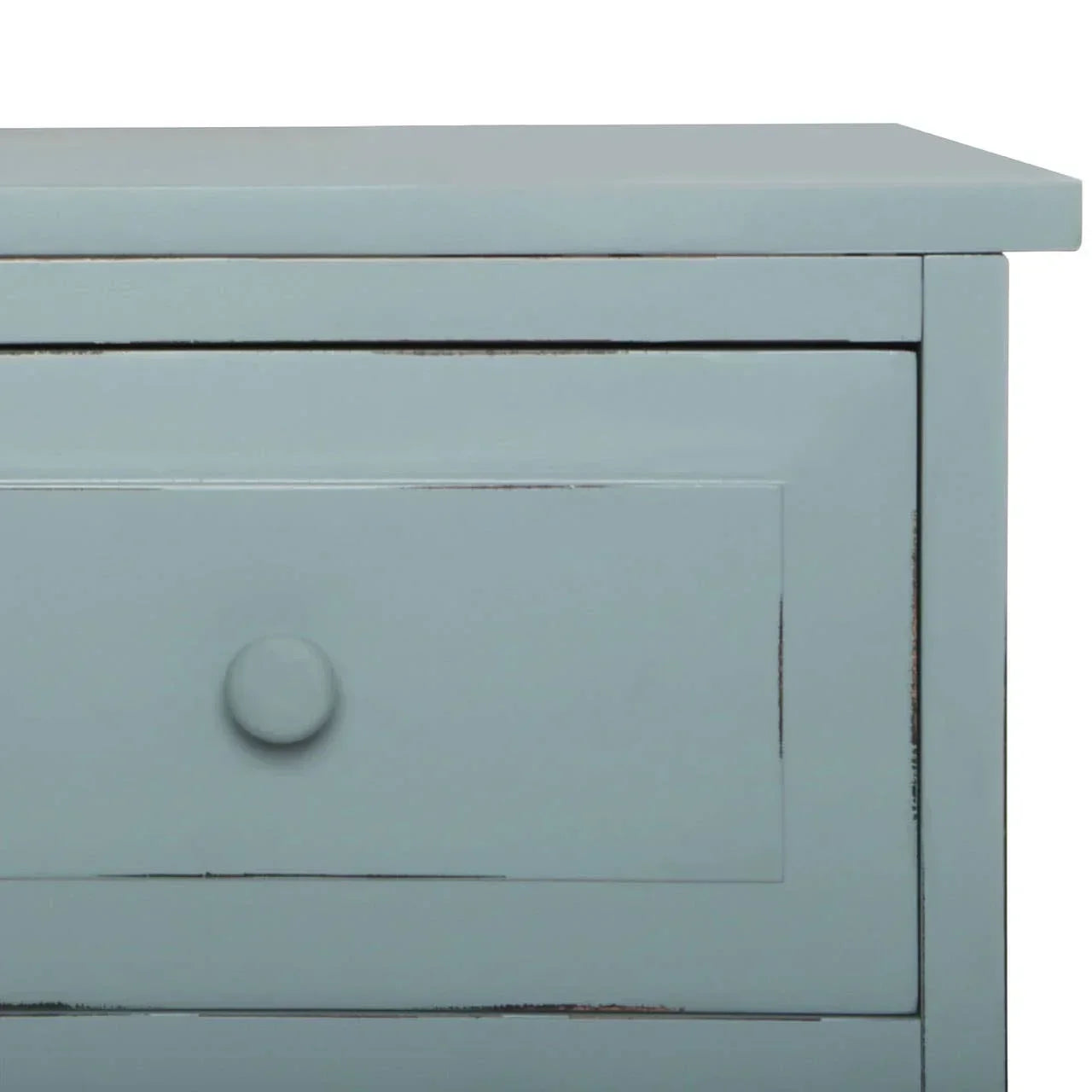Light blue wooden chest of drawers corner with knob and panel details, close-up view