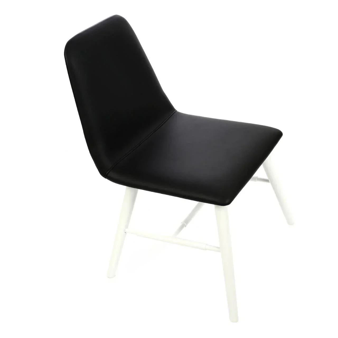 Black dining chair with white wooden legs and cushioned seat, angled side view