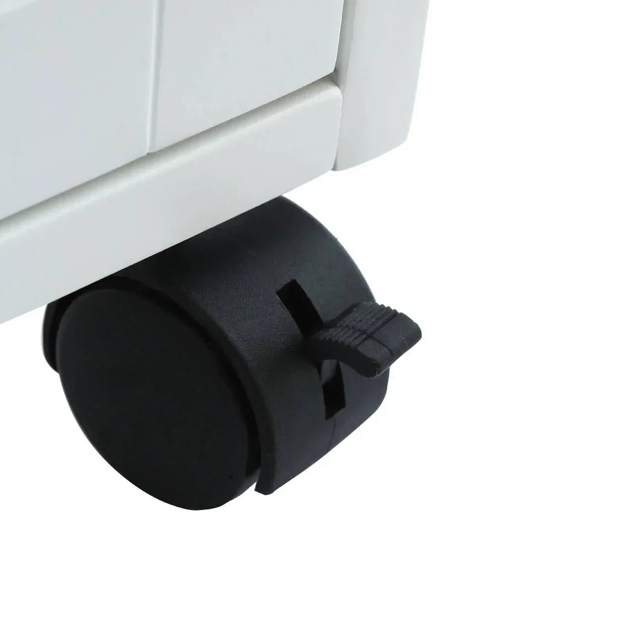 Close-up of furniture caster wheel with brake on white cabinet base