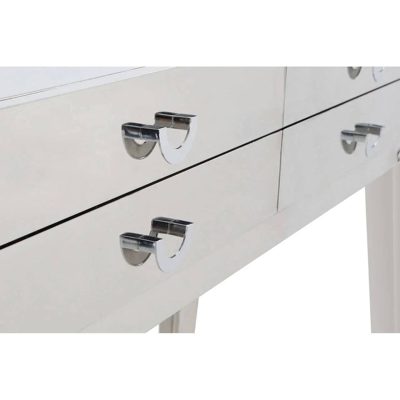 Close-up of mirrored dressing table drawers with chrome handles