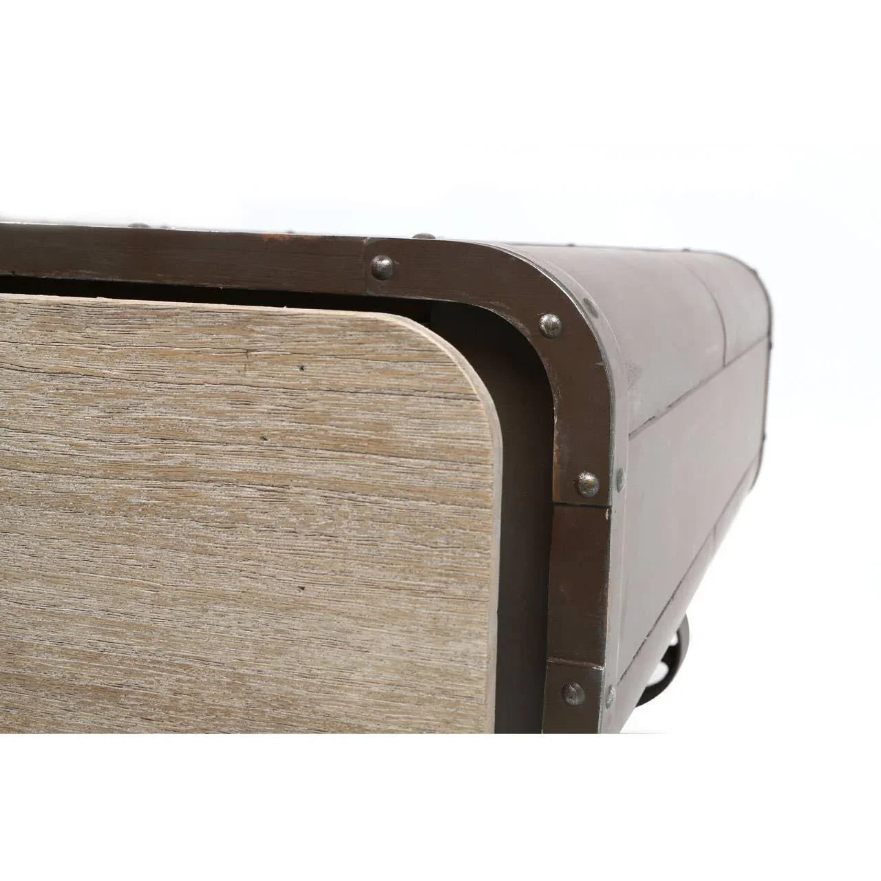Closeup of wooden and metal storage trunk with rivet details on corner