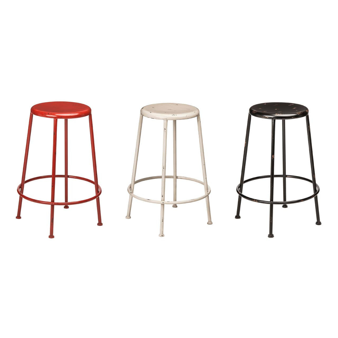 Three metal bar stools in red, cream, and black colors, featuring a simple, modern design with a round seat and slender legs. The stools are arranged side by side against a plain background