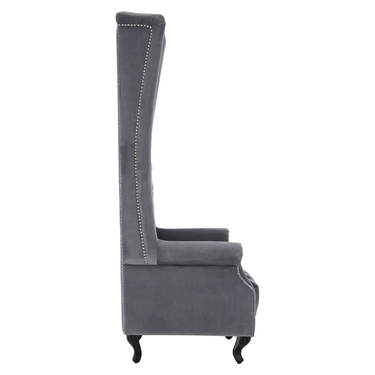 Side view of grey velvet accent chair with high back and silver nailhead trim