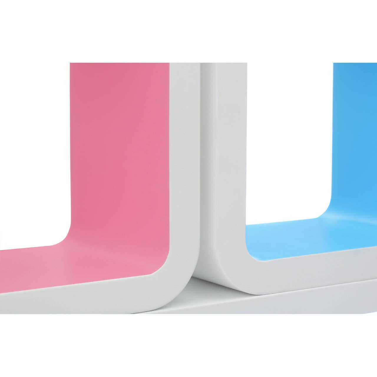 Three floating wall cubes in white, featuring colorful interiors in pink and blue. The cubes have a modern, sleek design with rounded edges, showcasing the vibrant colors against the white exterior